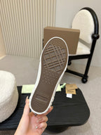 Burberry sneaker outsole view with textured gray tread and low-top profile