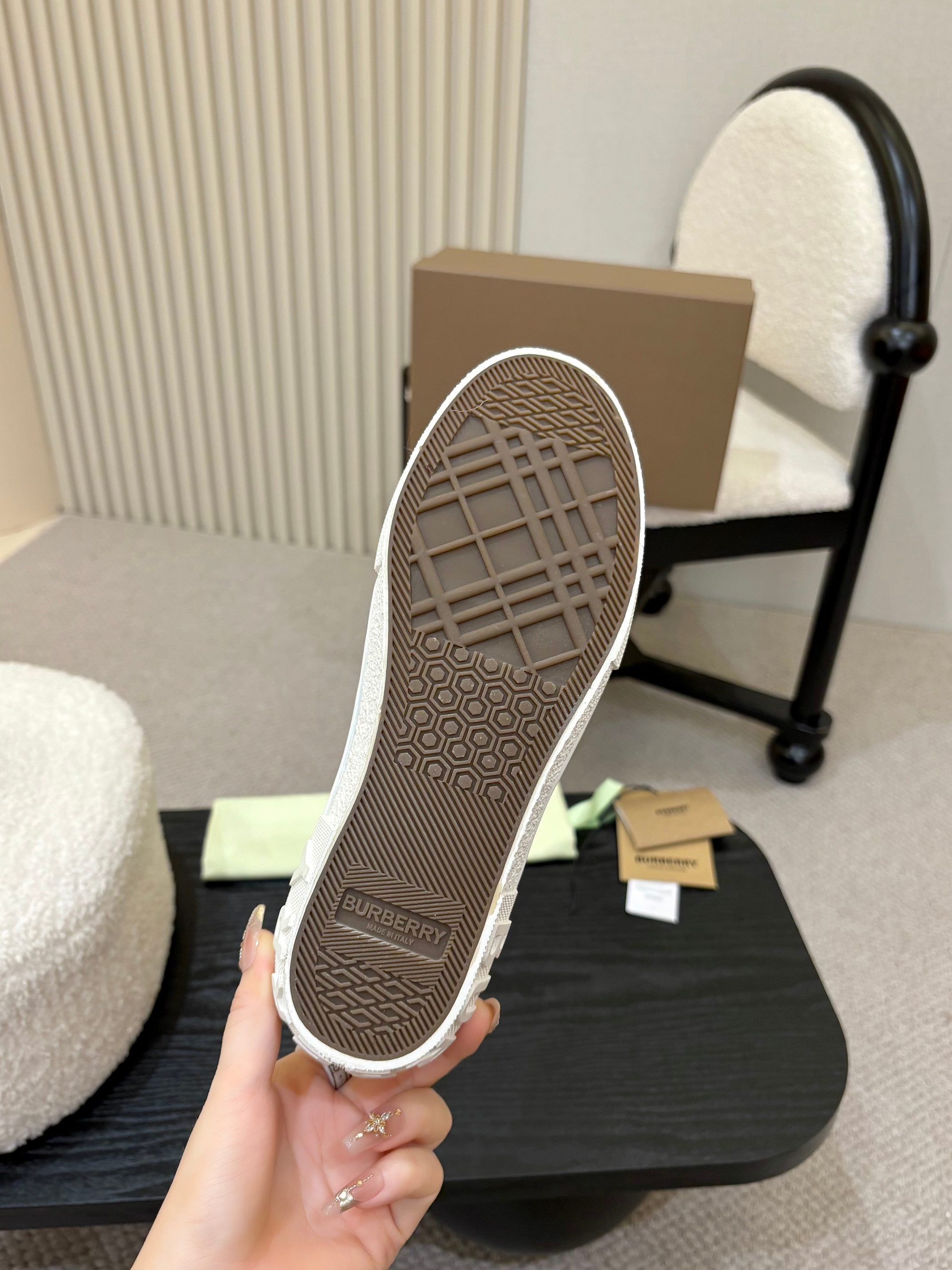 Burberry sneaker outsole view with textured gray tread and low-top profile