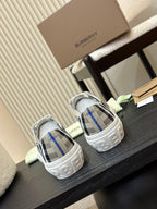 Burberry low-top sneakers, white uppers with black and blue check pattern, pair