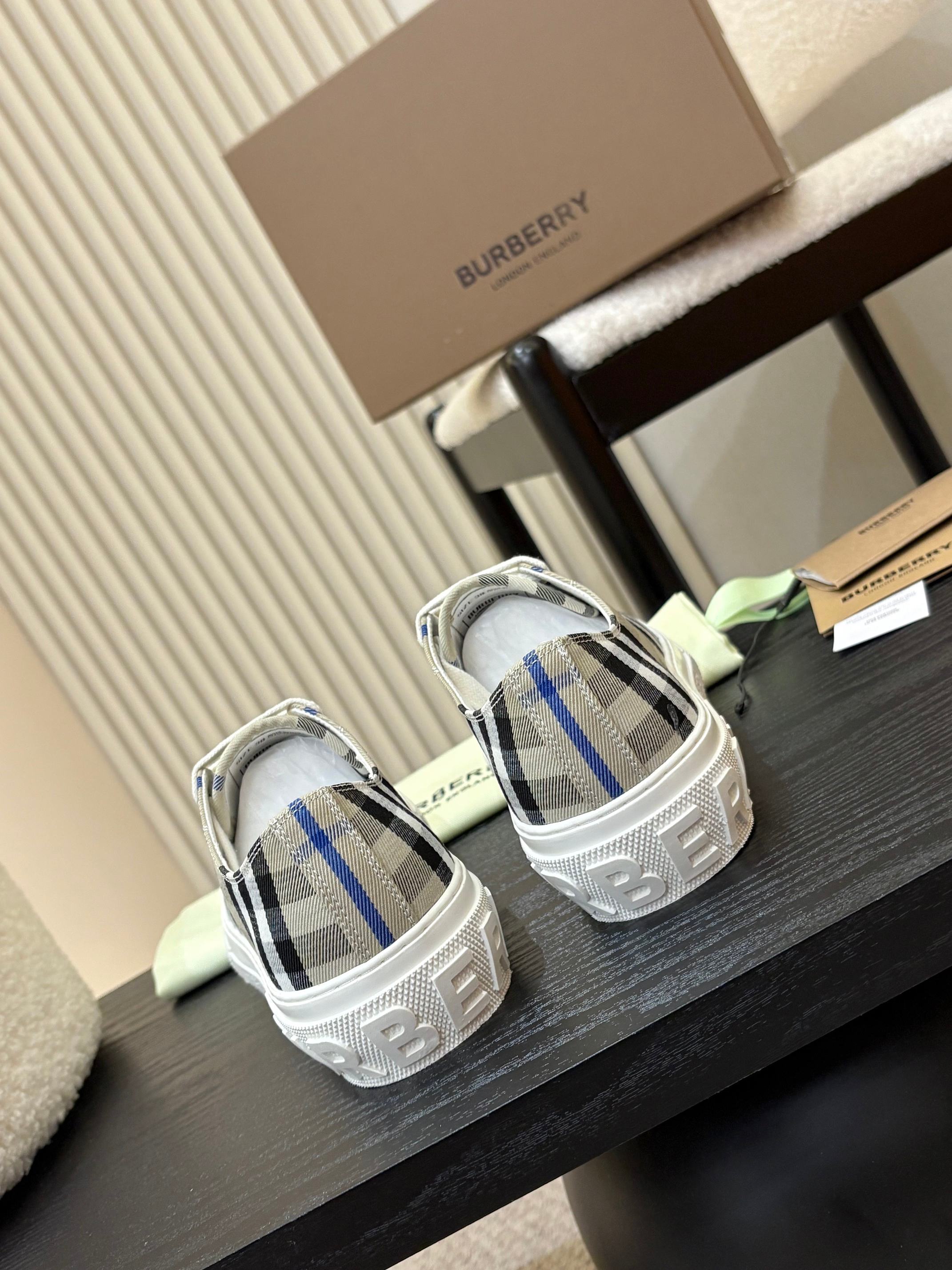 Burberry low-top sneakers, white uppers with black and blue check pattern, pair