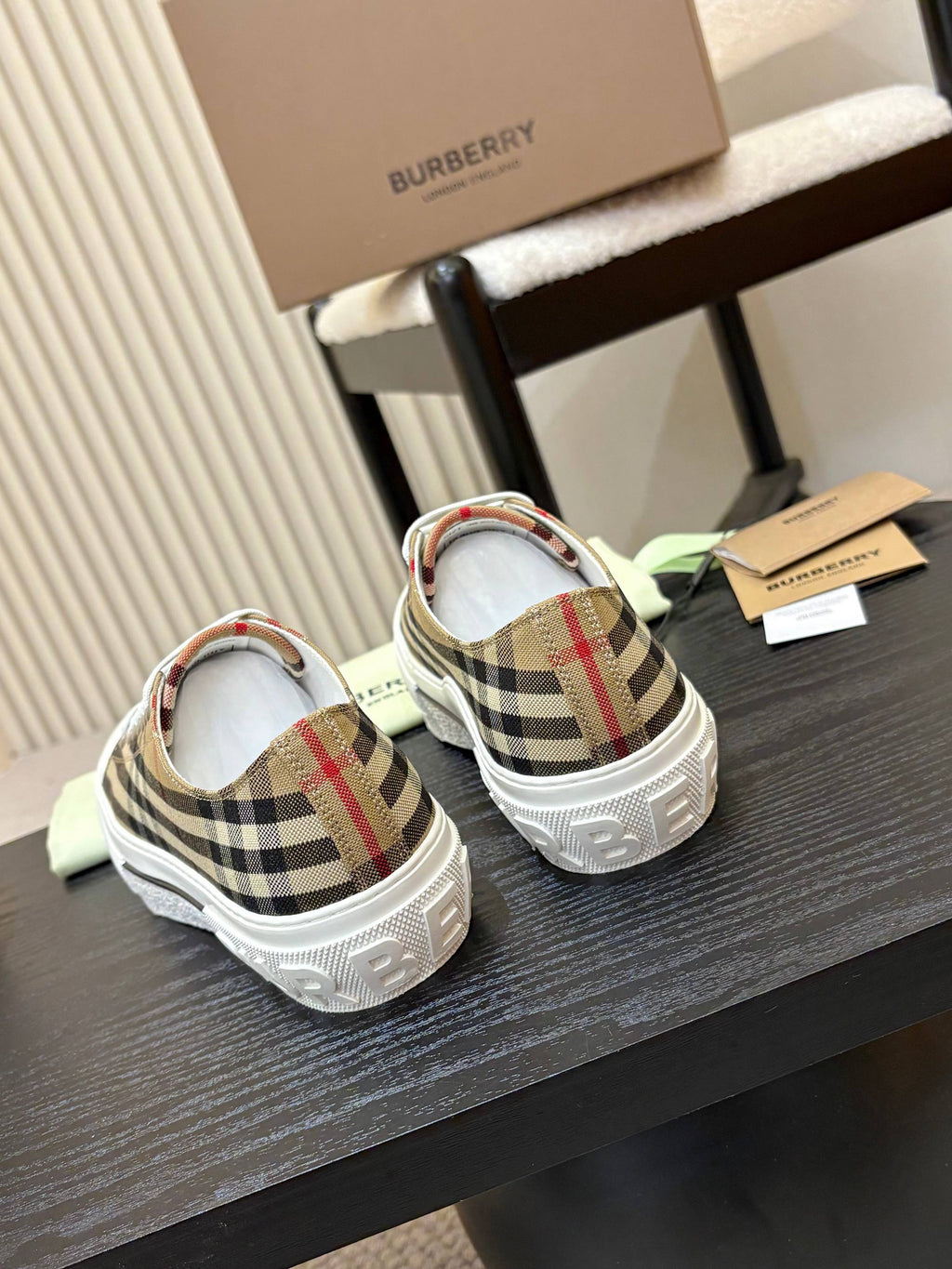 Burberry sneakers, rear view with plaid heel panels and white rubber soles
