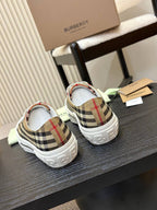 Burberry sneakers, rear view with plaid heel panels and white rubber soles