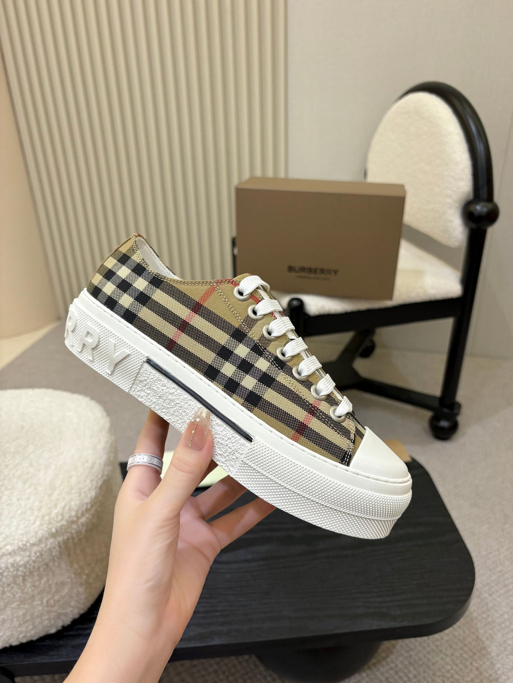 Burberry sneakers, side view with plaid fabric upper and white rubber sole