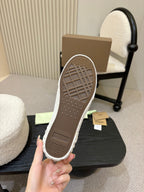 Burberry sneaker outsole in blue and white plaid, textured rubber tread