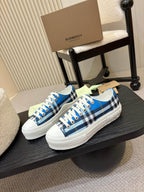 Burberry low-top sneakers, blue plaid panels, white rubber toe and sole