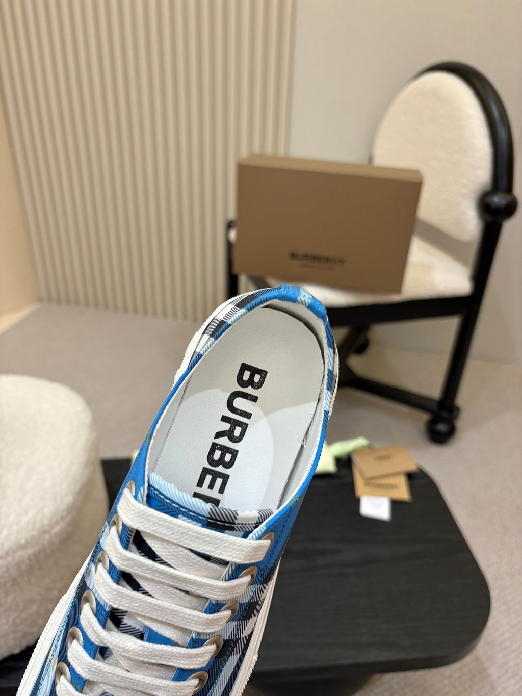 Burberry sneakers heel view, blue plaid with black “BURBERRY” lining