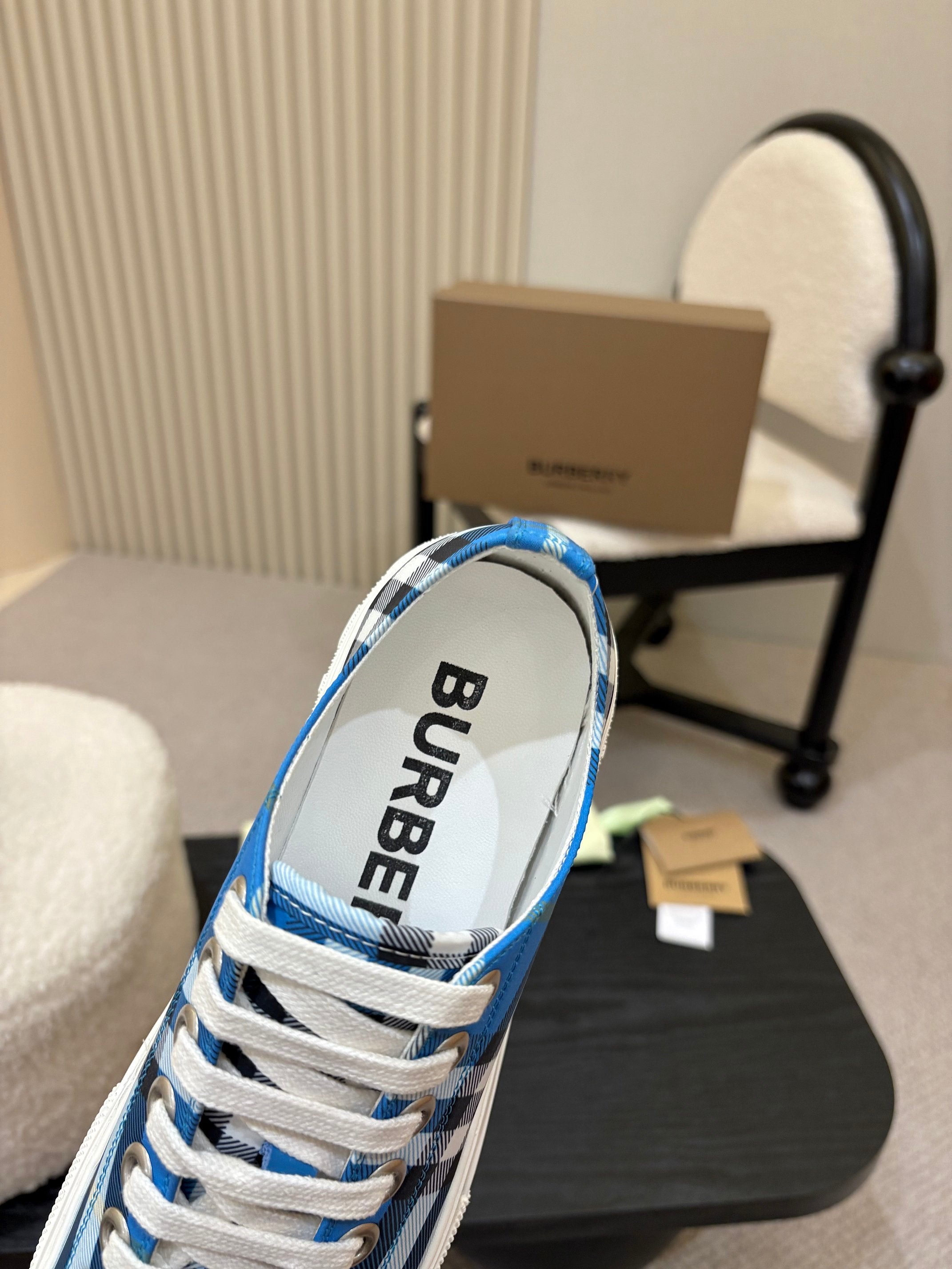 Burberry sneakers heel view, blue plaid with black “BURBERRY” lining