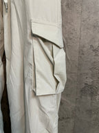 White cargo pants with side flap pocket and topstitched seams