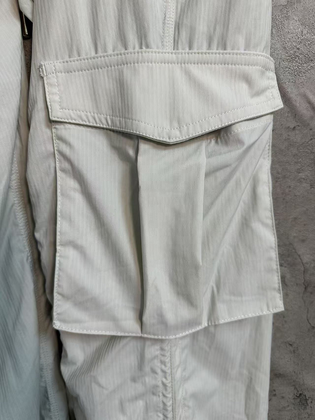 White cargo pants with hip flap pocket and drawcord waist