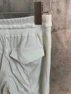 White cargo pants with rear patch pocket and ribbed waistband