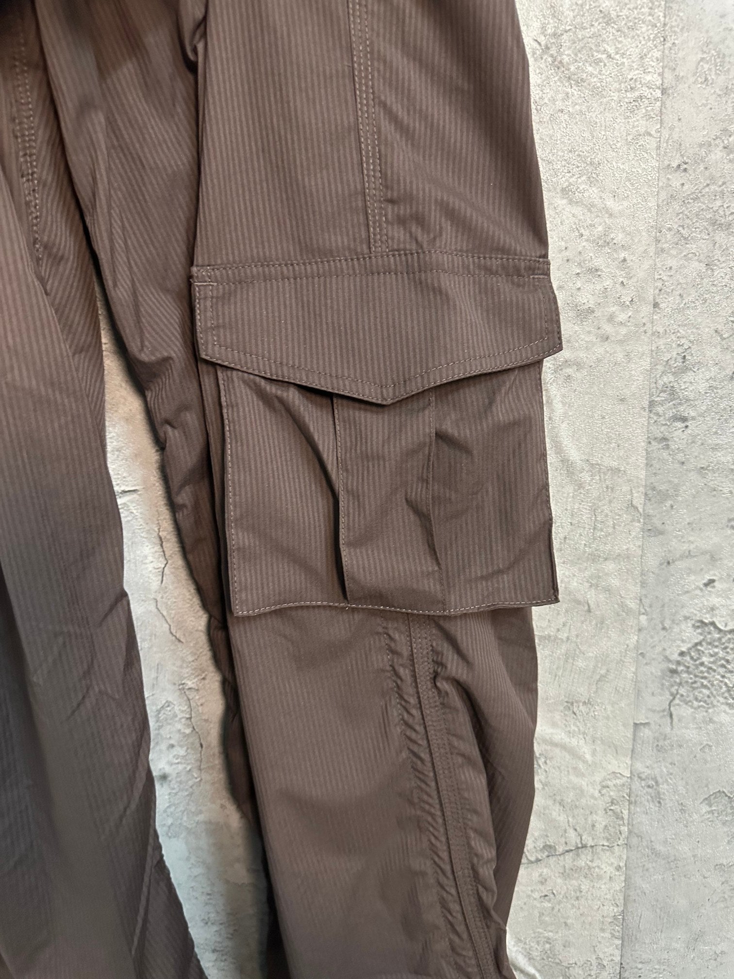Brown cargo pants with side pocket panel and tapered leg
