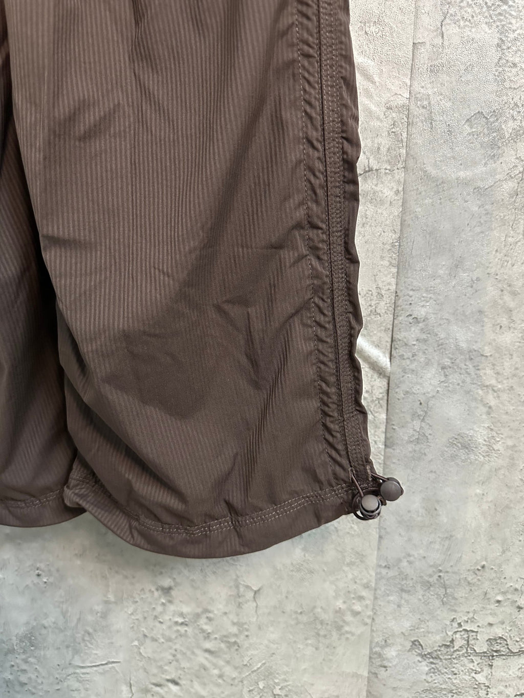 Brown cargo pants with hem detail and adjustable drawcord