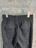 Black cargo pants with elastic waistband and drawstring fly
