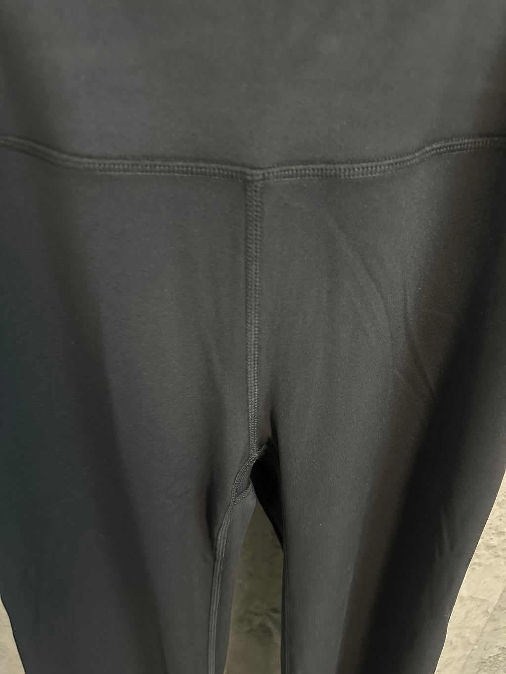 Black pants with front seam and leg opening detail