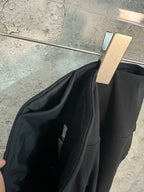 Black trousers fabric fold and side panel seam