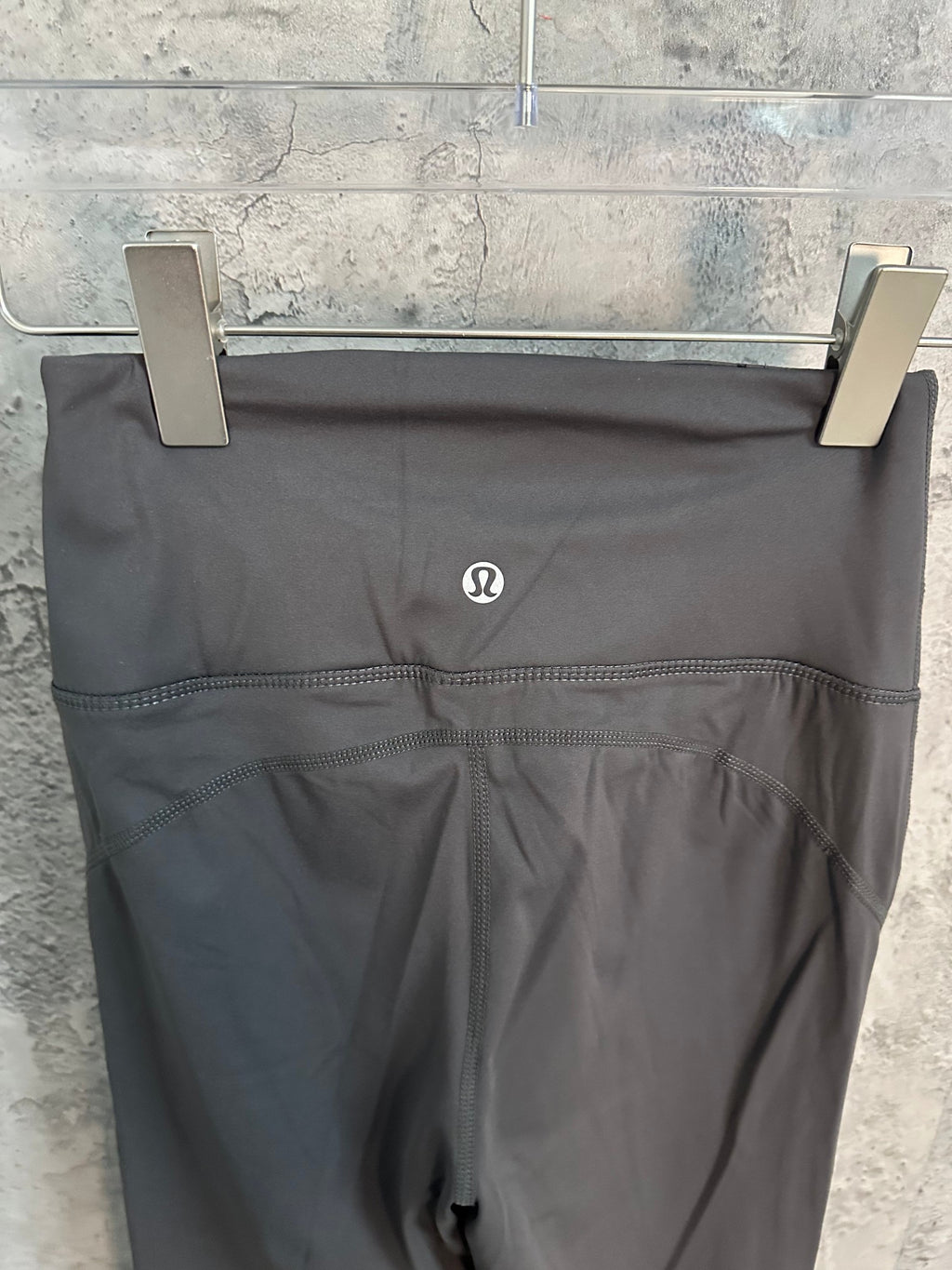 Charcoal wide-leg pants with small logo at front waistband