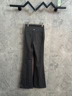 Dark wide-leg pants with pleated front and elastic waistband