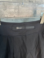 Black skort waistband with small belt detail and stitched front pocket