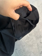 Black skort with hand-part opening showing inner lining and seams