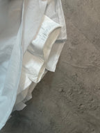 White skirt with overlapping panels and side seam detail