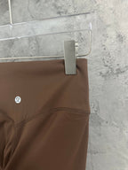 Brown pants with stitched waistband and logo at side
