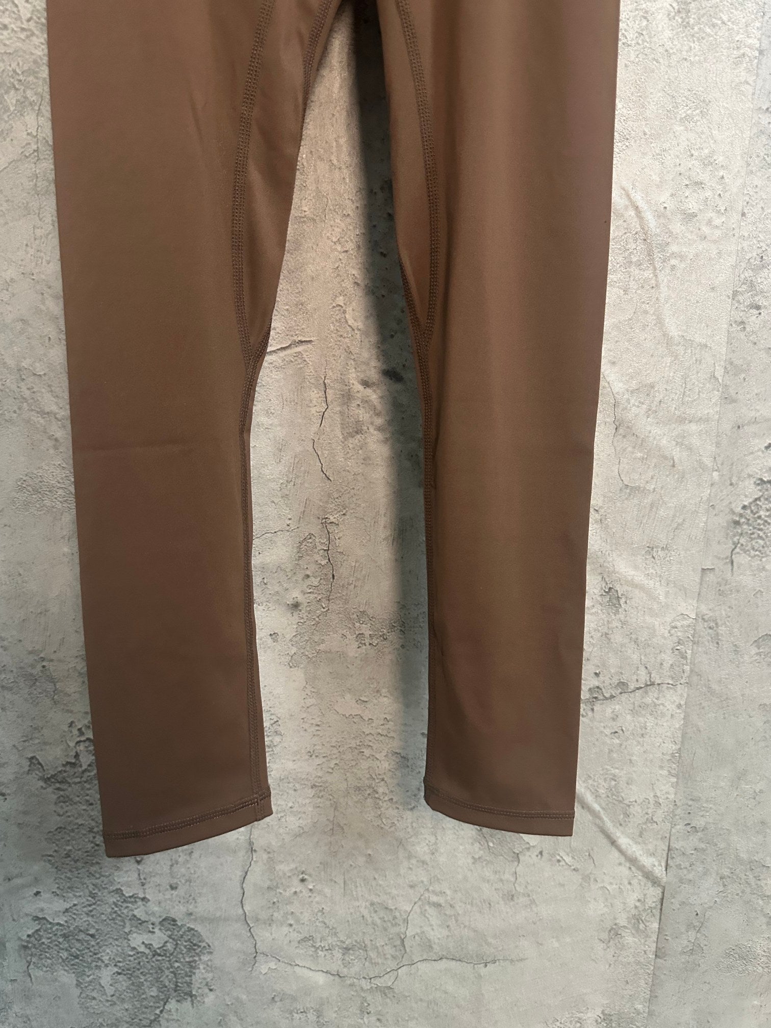 Brown straight-leg pants, full length view
