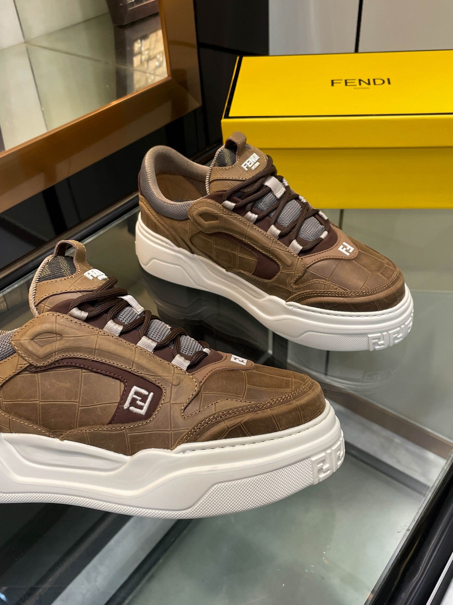 Brown Fendi sneakers with white sole, logo patch on the side, lace-up
