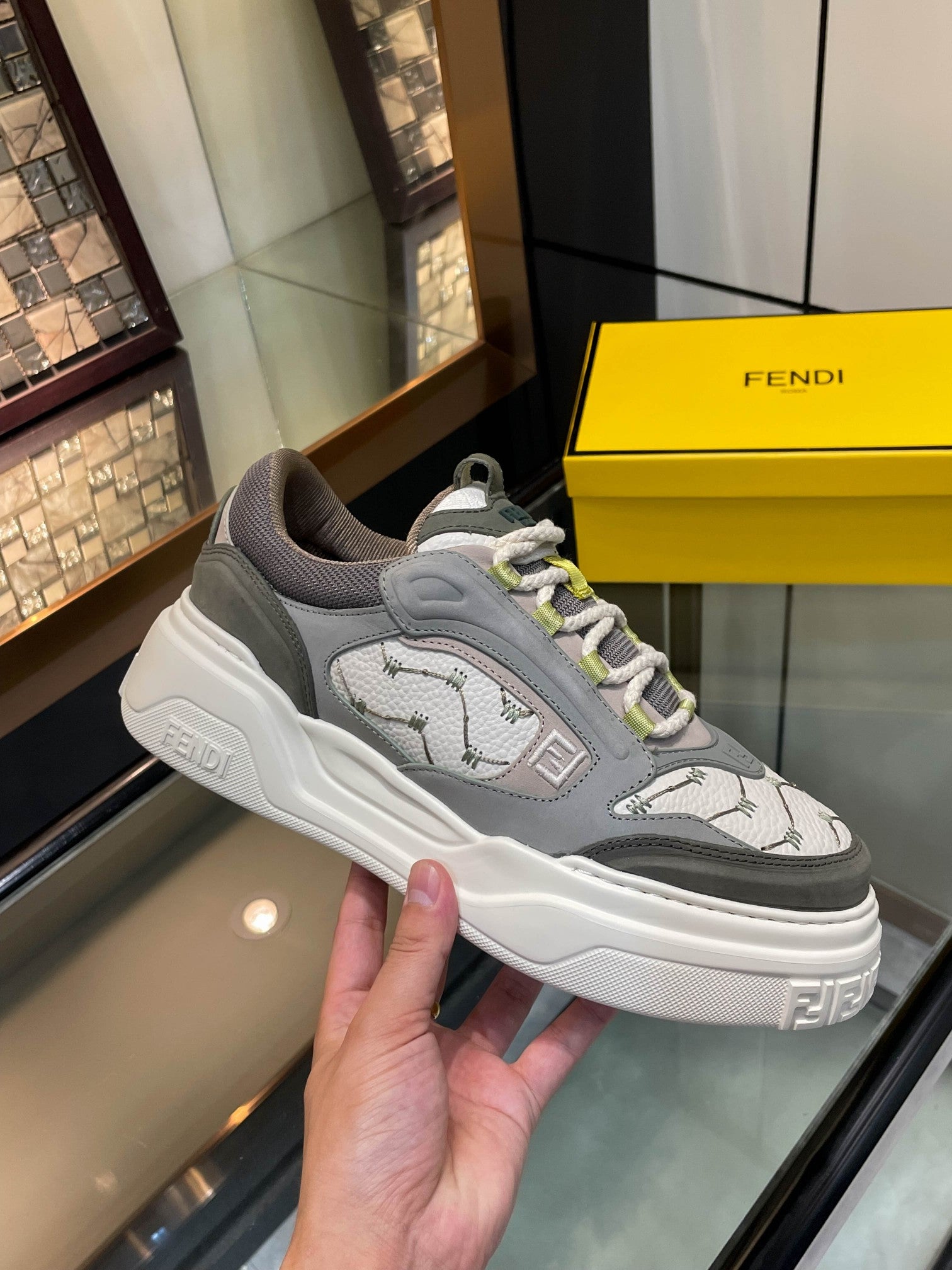 Gray unisex lace-up sneakers with white platform sole, animal print panel and lime laces