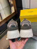 Gray unisex sneakers with white heel cup and FENDI logos on back, lime lace accents