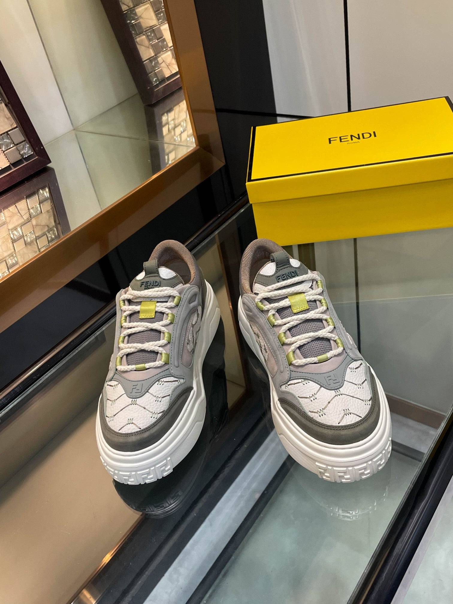 Gray unisex sneakers with white platform sole and lime accents, lace-up design