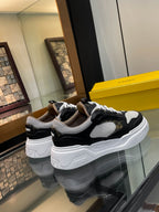 Dark and white unisex sneakers with lace-up design and thick platform sole