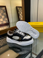 Shoe outsole of dark and white unisex sneakers with deep tread pattern