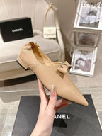 Chanel beige patent flats, pointed toe, bow at vamp, low block heel