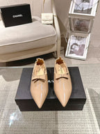 Chanel beige patent flats pair on box, pointed toe and bow detail