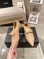 Chanel beige patent flats pair, pointed toe slip-on with bow detail