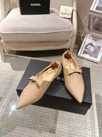 Chanel beige patent flats with pointed toe, bow at vamp, low heel