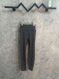 Black slim-fit pants with waistband and front opening seam