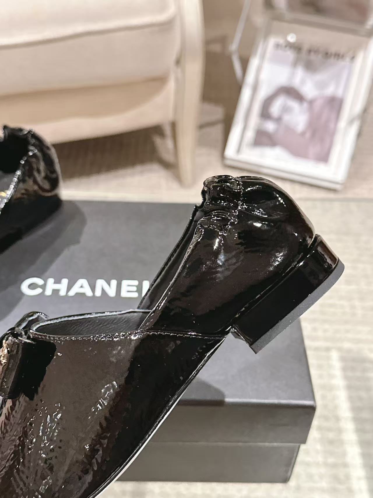 Black patent leather ladies loafer-style shoes, pointed toe, low block heel
