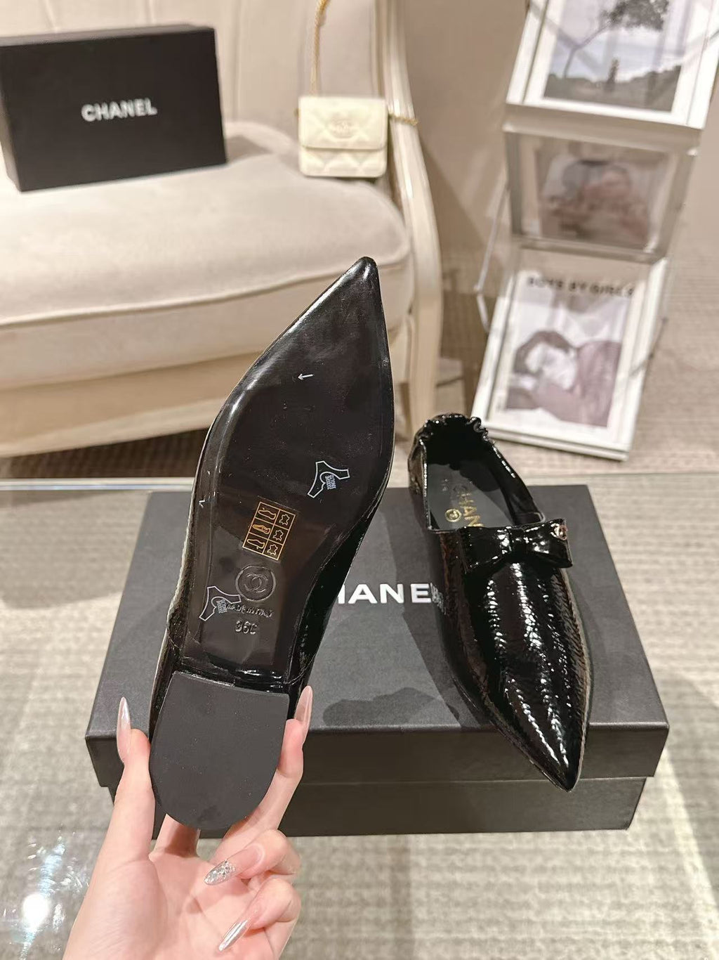 Black patent leather ladies slip-on shoes, pointed toe, low block heel, bow strap