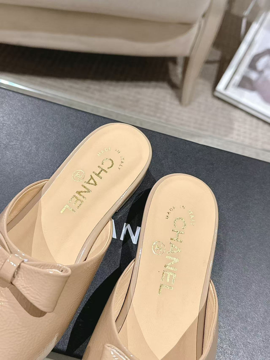 Beige patent mule slides with open back and pointed toe