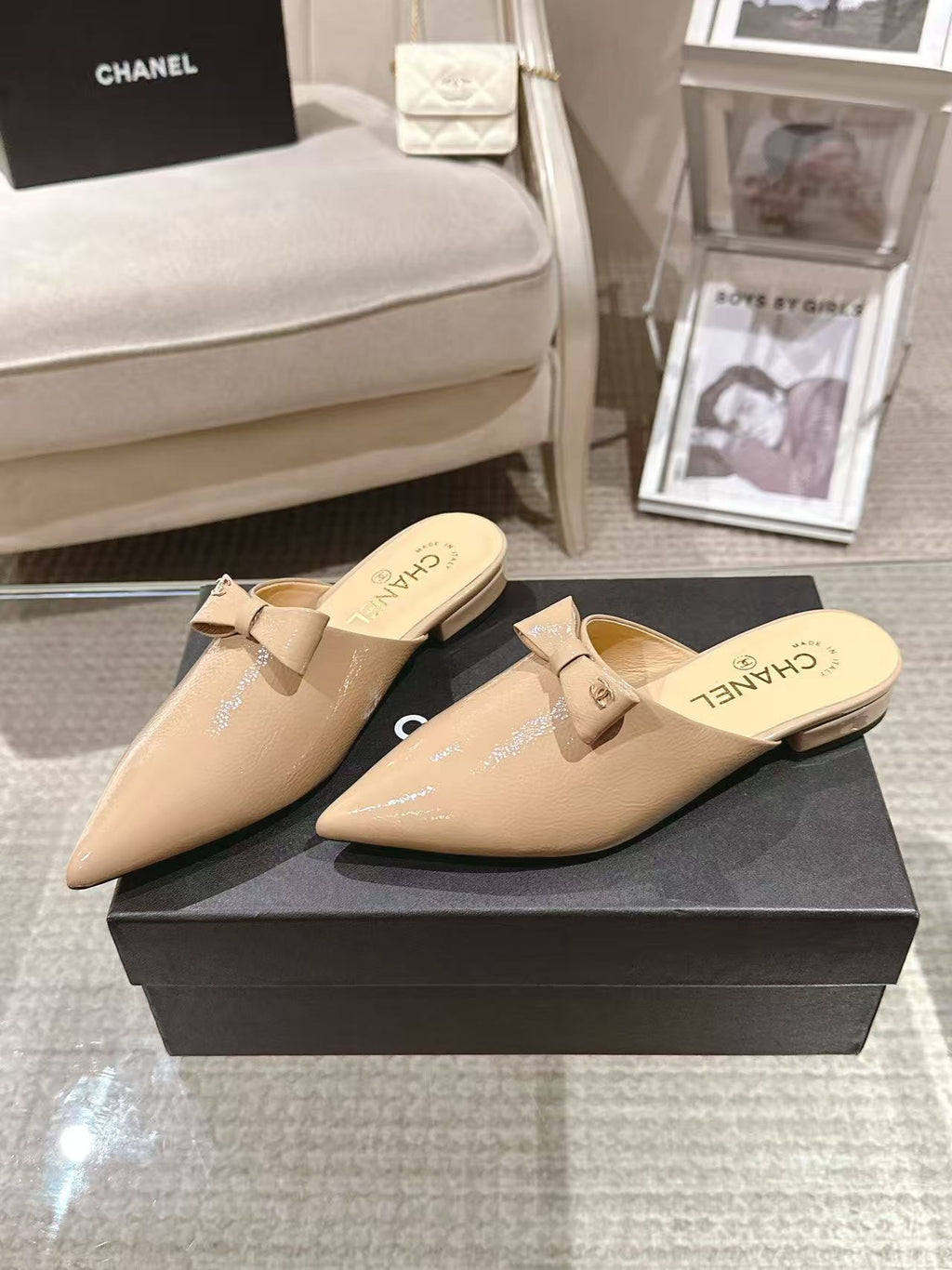 Beige patent mule slides with bow strap and pointed toe pair