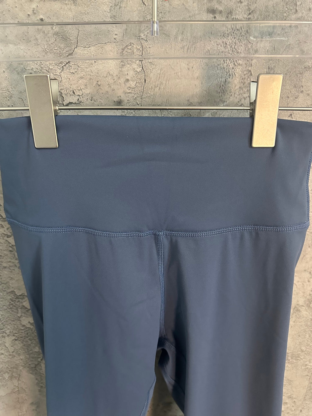 Blue leggings waistband and front panel close-up
