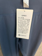 Blue leggings with hang tag attached at waistband