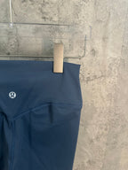 Blue leggings close-up of logo and waistband seam