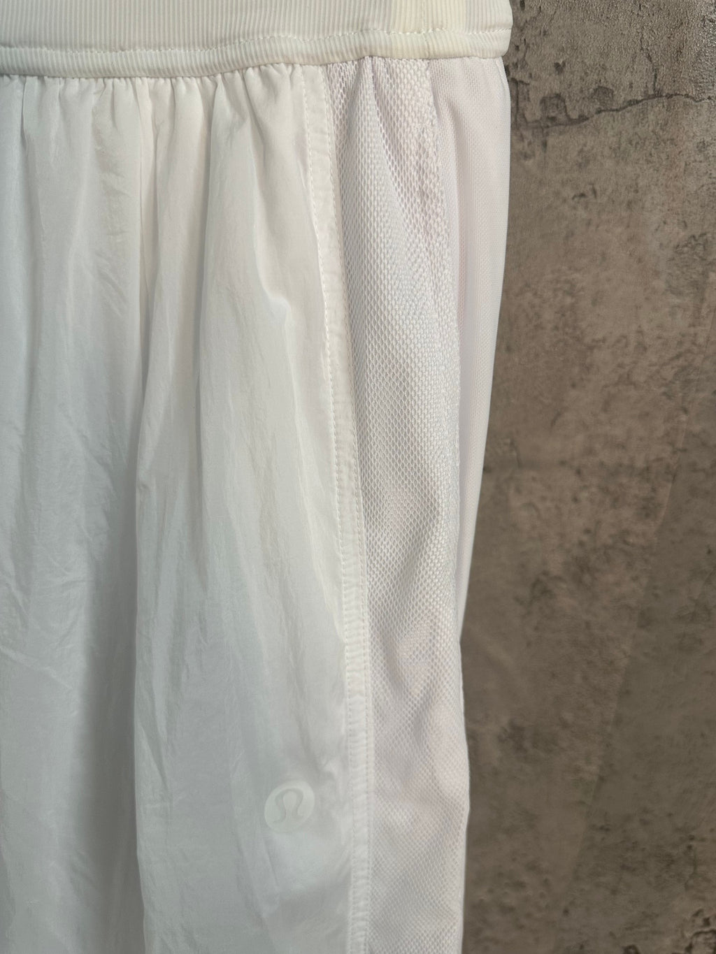 White skirt side with elastic waistband and subtle textured panel