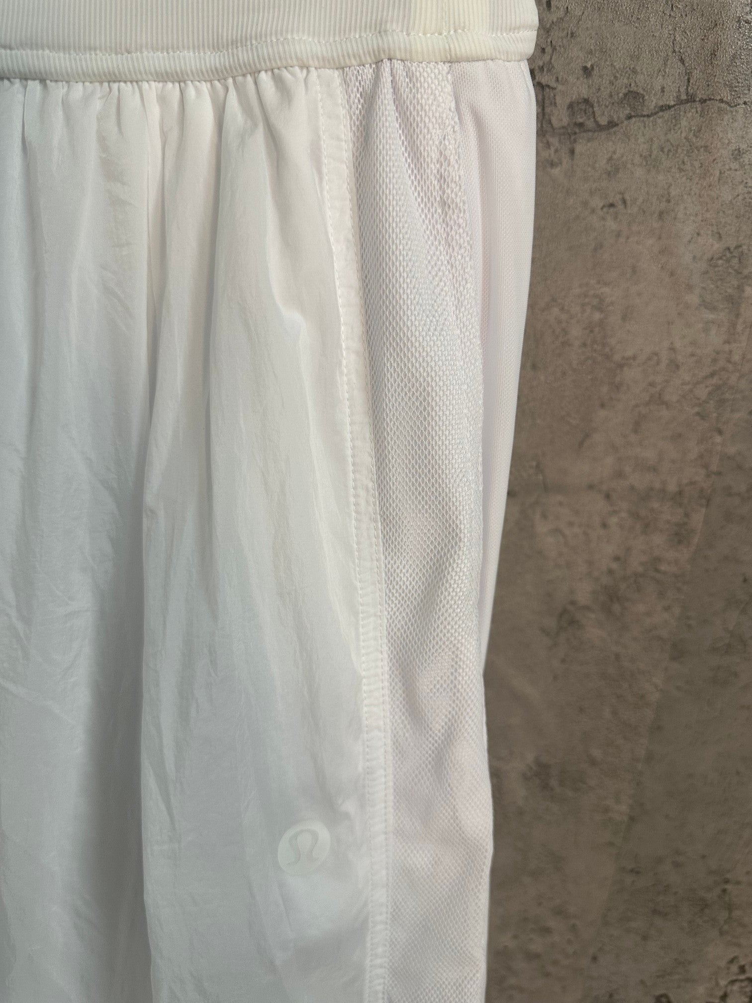 White skirt side with elastic waistband and subtle textured panel