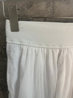 White skirt front with elastic waistband and gathered fabric