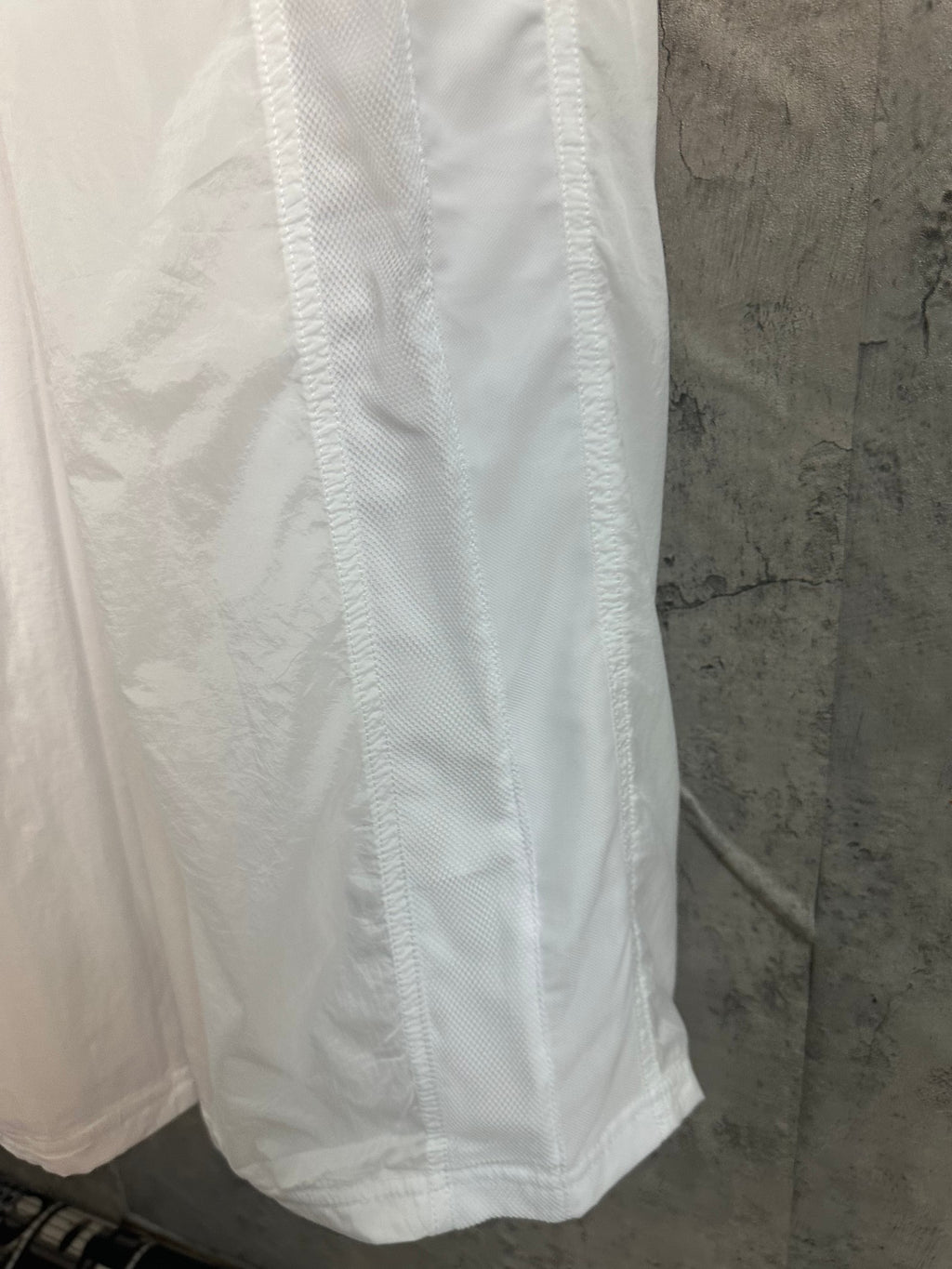 White skirt with gathered lower hem and vertical seam lines