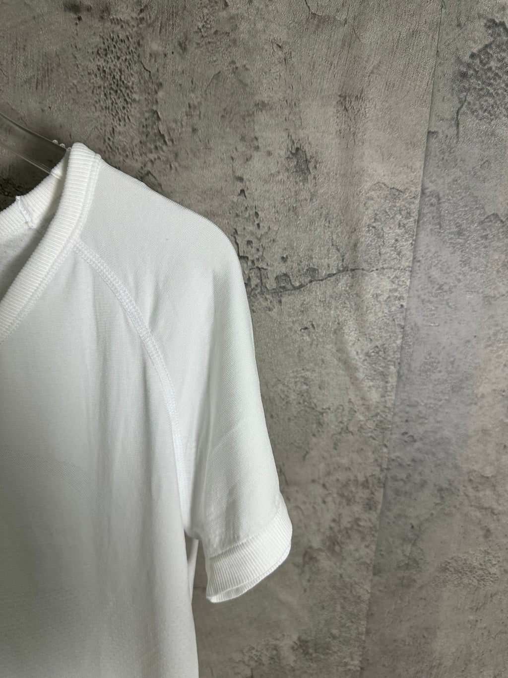 White T-shirt with short sleeves, ribbed hem, and side seam detail