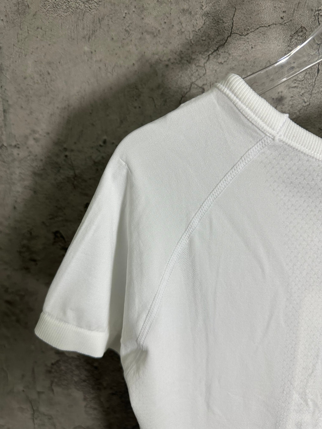White T-shirt back view with short sleeves and stitched shoulder line